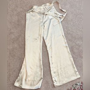 Cream pants, zip back, tie in front. Never worn tags still attached.